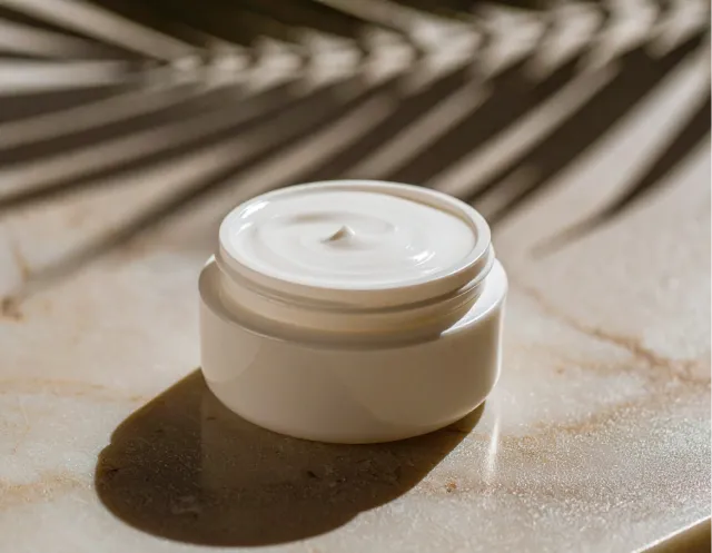 Various cosmetics and beauty products arranged elegantly